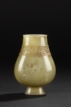 A CARVED WHITE JADE VASE