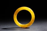 A YELLOW JADE ROUND BANGLE