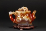 A RARE CARVED LARGE RED AGATE TEAPOT