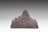 A CARVED DUAN STONE BRUSH REST