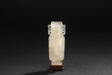 A SMALL WHITE AGATE VASE WITH TWO HANDLES