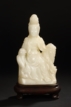 A CARVED DONG SOAPSTONE FIGURE OF GUANYIN
