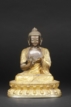 A GILT-BRONZE FIGURE OF SEATED MAITREYA