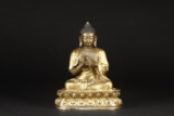 A SEATED GILT-BRONZE FIGURE OF DĪPANKARA