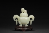A CARVED WHITE JADE TRIPOD CENSER