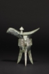 A BRONZE RITUAL TRIPOD VESSEL, JUE