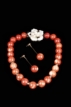 A SET OF CORAL NECKLACE AND A PAIR OF CORAL EARRINGS