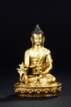 A GILT-BRONZE FIGURE OF BHAISAJYAGURU