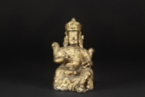 A SEATED TIBETAN GILT-BRONZE FIGURE OF WHITE JAMBHALA