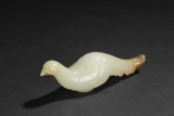 A CARVED WHITE JADE 'DOVE' STAFF-HEAD