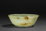 A CARVED CELADON JADE BOWL