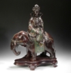 A BRONZE FIGURE OF PUXIAN RIDING ON ELEPHANT WITH CLOISONNE DECORATIONS