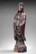 A CARVED HONGMU FIGURE OF GUANYIN