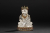 A CARVED CRYSTAL FIGURE OF BODHISATTVA INSET WITH GEMS