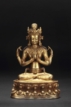 A GILT BRONZE FOUR-ARMED AVALOKITESVARA