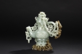 A CARVED CELADON JADE TEAPOT WITH COVER