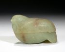 A CARVED CELADON JADE QUAIL-FORMED BOX AND COVER