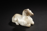 A WHITE AND RUSSET JADE 'HORSE'