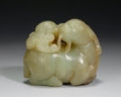 A WHITE JADE CARVING OF A RAM