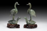 A PAIR OF CARVED JADE ‘LONGEVITY’ ANIMAL FIGURES