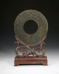 AN ARCHAIC GREEN JADE DISC, HUAN