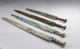 A GROUP OF FOUR ARCHAIC BRONZE SWORDS