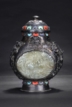 A CARVED SILVER MOON FLASK EMBEDDED WITH JADE