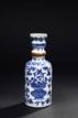 AN UNUSUAL BLUE AND WHITE BOTTLE