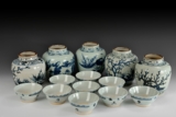 A SET OF PROVINCIAL KILN UNDERGLAZED BLUE AND WHITE BOWLS AND FLASKS