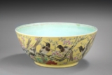 A LARGE YELLOW-GROUND FAMILLE ROSE 'FLOWERS AND BIRDS' BOWL