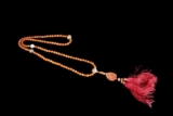 A NECKLACE OF AMBER AND BHAISAJYAGURU'S DZI BEADS, CHAOZHU