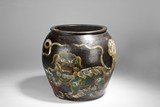A BLACK GLAZED JAR WITH QILIN DESIGN