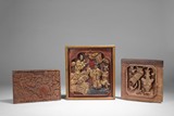 A GROUP OF THREE CARVED WOOD PANELS