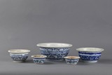 A GROUP OF FIVE BLUE AND WHITE BOWLS