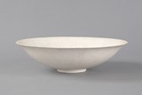 A WHITE GLAZED PORCELAIN BOWL