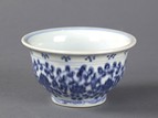A BLUE AND WHITE SMALL CUP