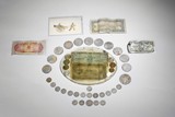 A GROUP OF VINTAGE COINS AND PAPER CURRENCIES