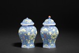 A PAIR OF BLUE GLAZED JARS WITH LIDS