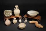 A GROUP OF POTTERY PIECES