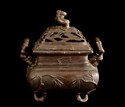 A BRONZE CENSER WITH COVER