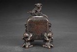 A BRONZE FOUR-LEG TWO-HANDLED SQUARE CENSER