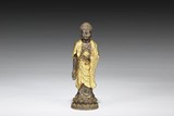 A BRONZE GILT SAKYAMUNI STATUE