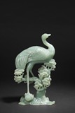 A JADE CARVED CRANE FIGURE