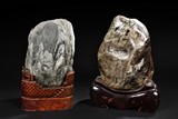 TWO NATURAL STONE BOULDERS WITH STANDS