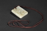 A CARVED WHITE JADE PENDANT