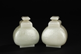A PAIR OF WHITE JADE VASES WITH COVERS