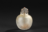 A CRYSTAL CARVED SNUFF BOTTLE