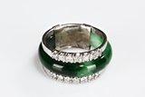 A JADEITE AND DIAMOND RING