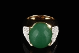 A LARGE 26.72 JADEITE DOUBLE CABOCHON 18K GOLD GENTLEMAN RING