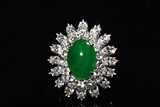 AN IMPRESSIVE JADEITE JADE AND DIAMOND PLATINUM RING